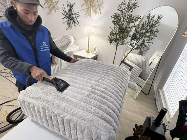 Xtreme Cleans technician performing upholstery cleaning in Annapolis MD